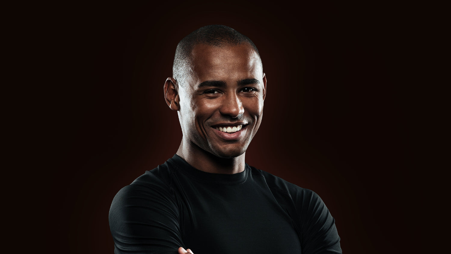A Black background image of a Happy Confident Man.